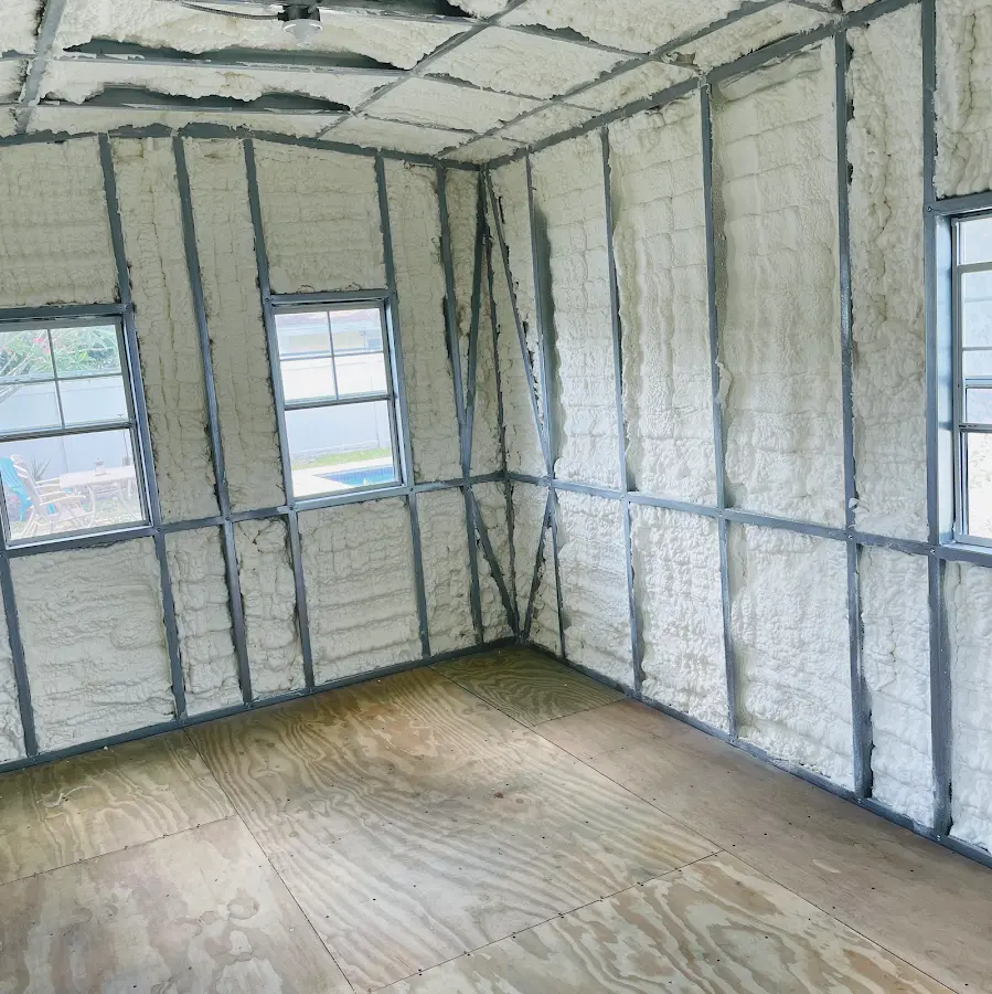 Closed-cell spray foam insulation applied to wall cavities in a residential project in Calumet
